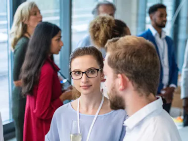 Group of men and women meeting.